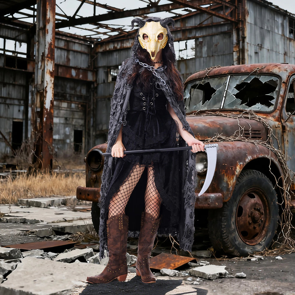 Goat mask costume for women styled with black dress and distressed cape at a Halloween event
