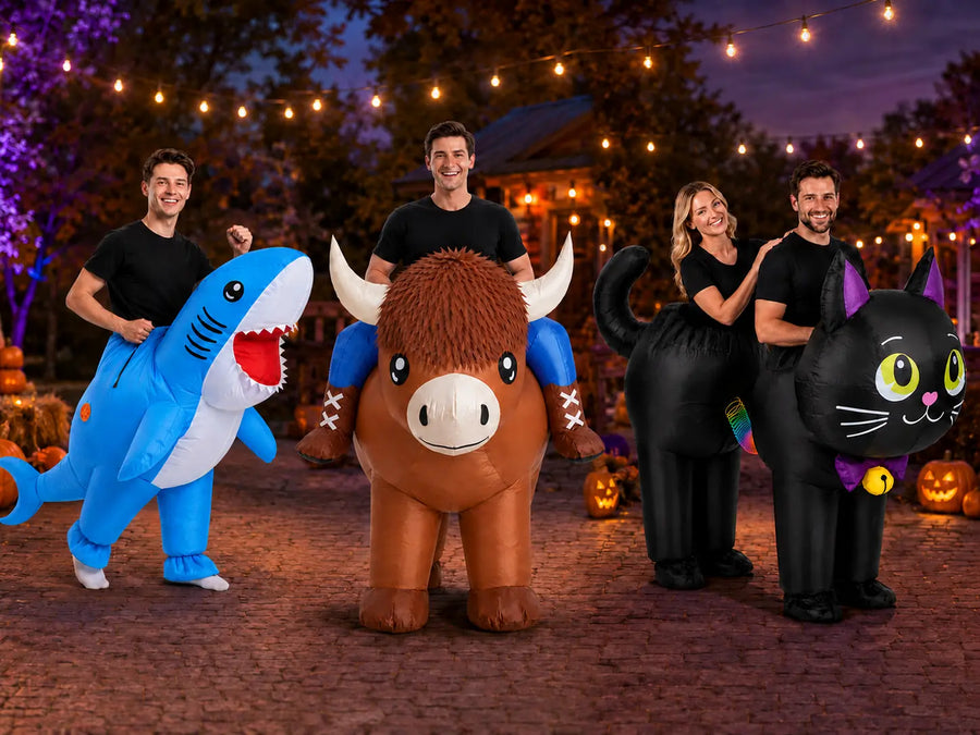 Adults wearing blue shark, ride-on Highland cow and connected black cat inflatable costumes at a Halloween party