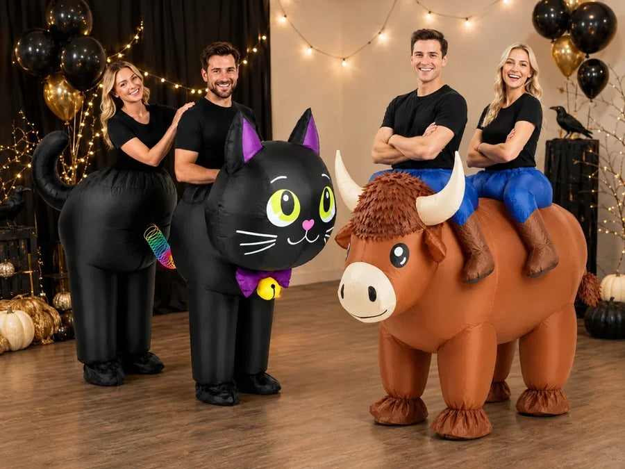 Two couples wearing black cat and Highland cow inflatable duo costumes at a Halloween party