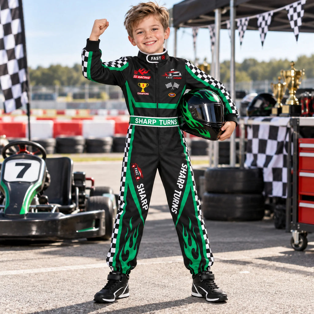 Child wearing a black and green racing jumpsuit holds a separate helmet beside go karts and checkered bunting.