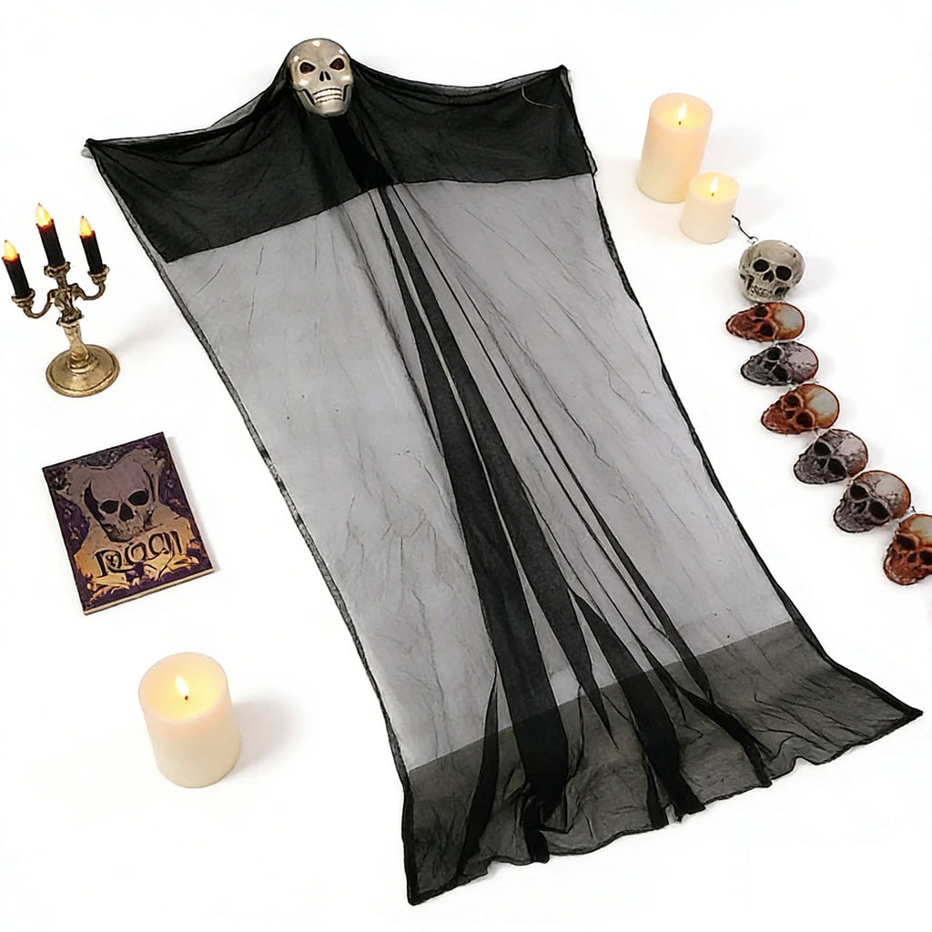 The 10-foot lighted hanging skeleton ghost is arranged flat with candles and Halloween props to show its full gauze shape.