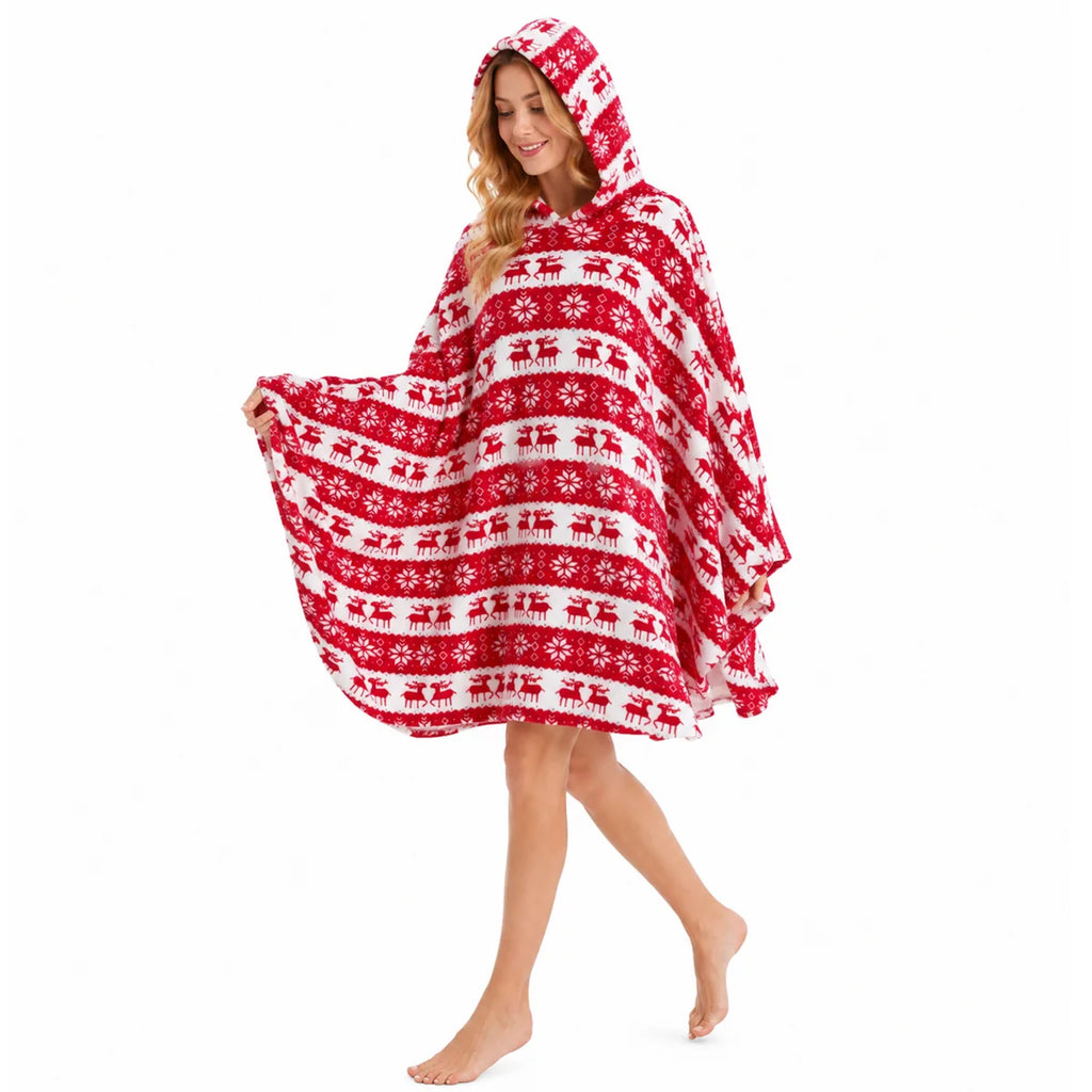 Woman wearing red reindeer snowflake hooded blanket