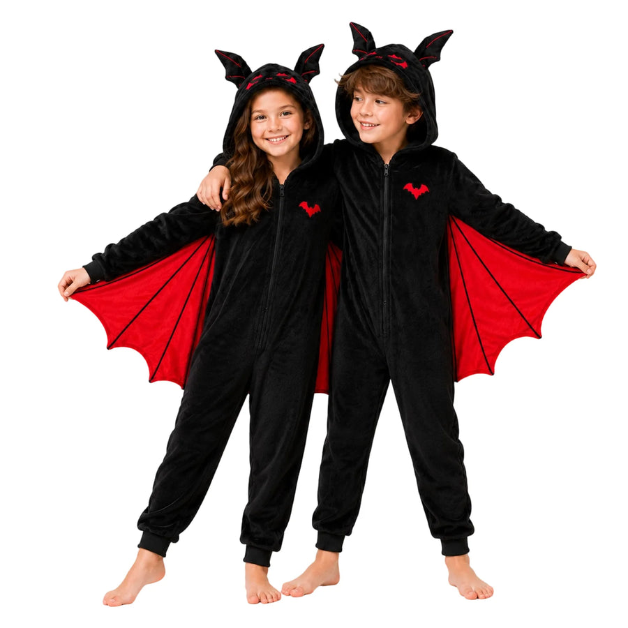 Two children model black bat onesies together, showing red and purple wing panels.
