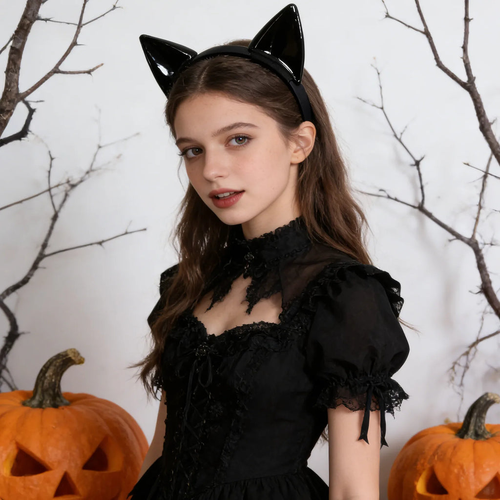The black cat ear headband displayed in a styled Halloween scene for visual context.