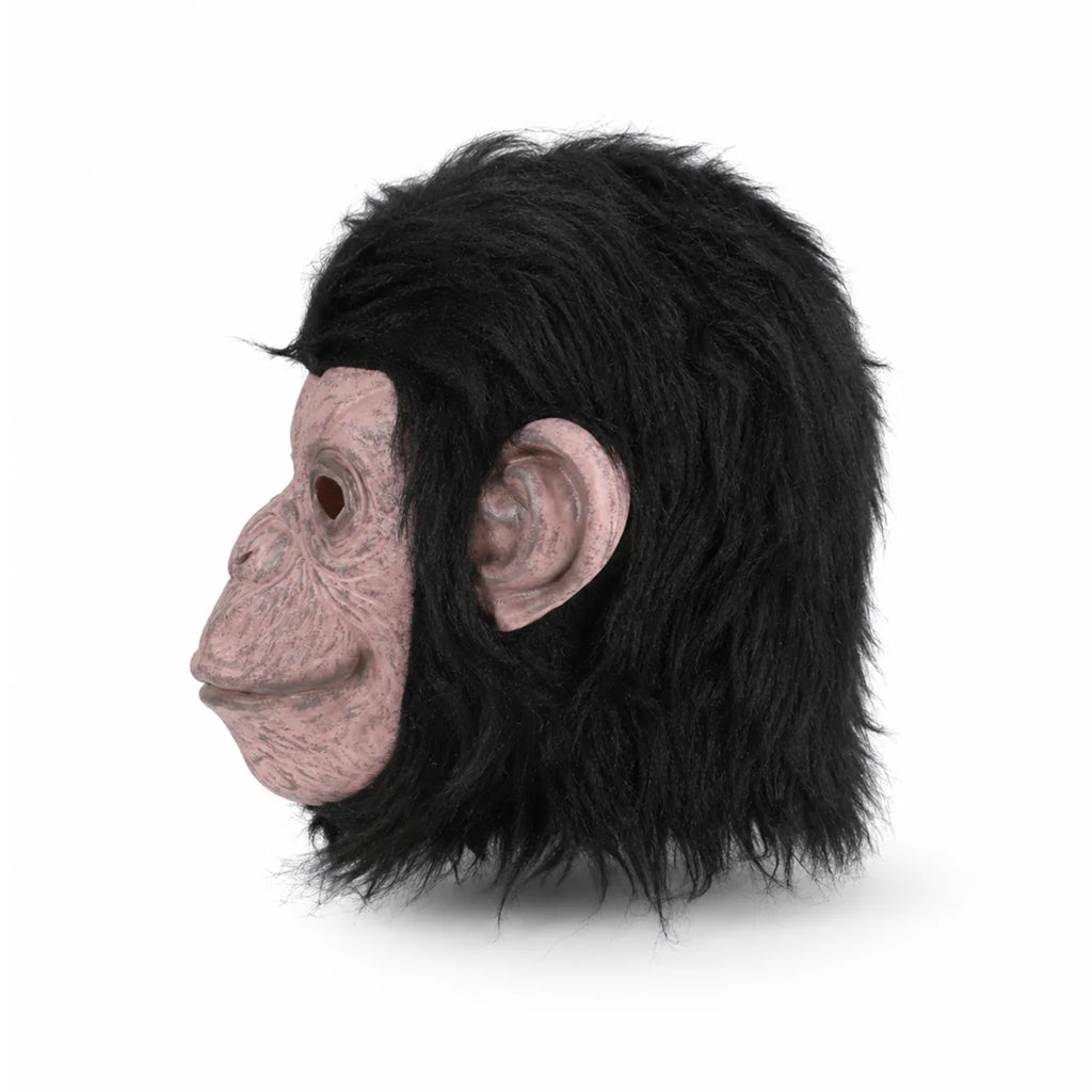 Side view of the black fur gorilla mask, showing its profile and visible construction details.