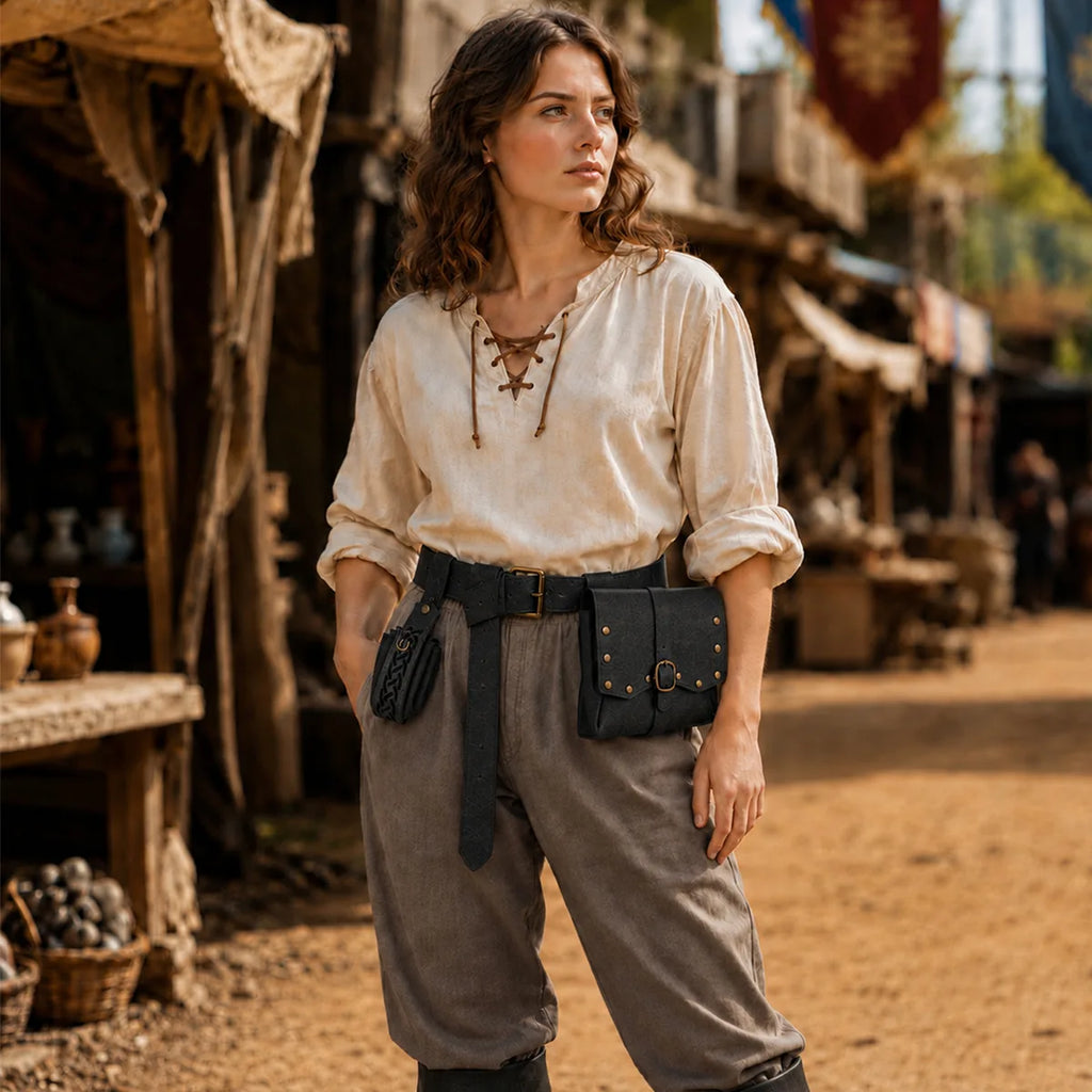 The black medieval belt set displayed in a styled Halloween scene for visual context.