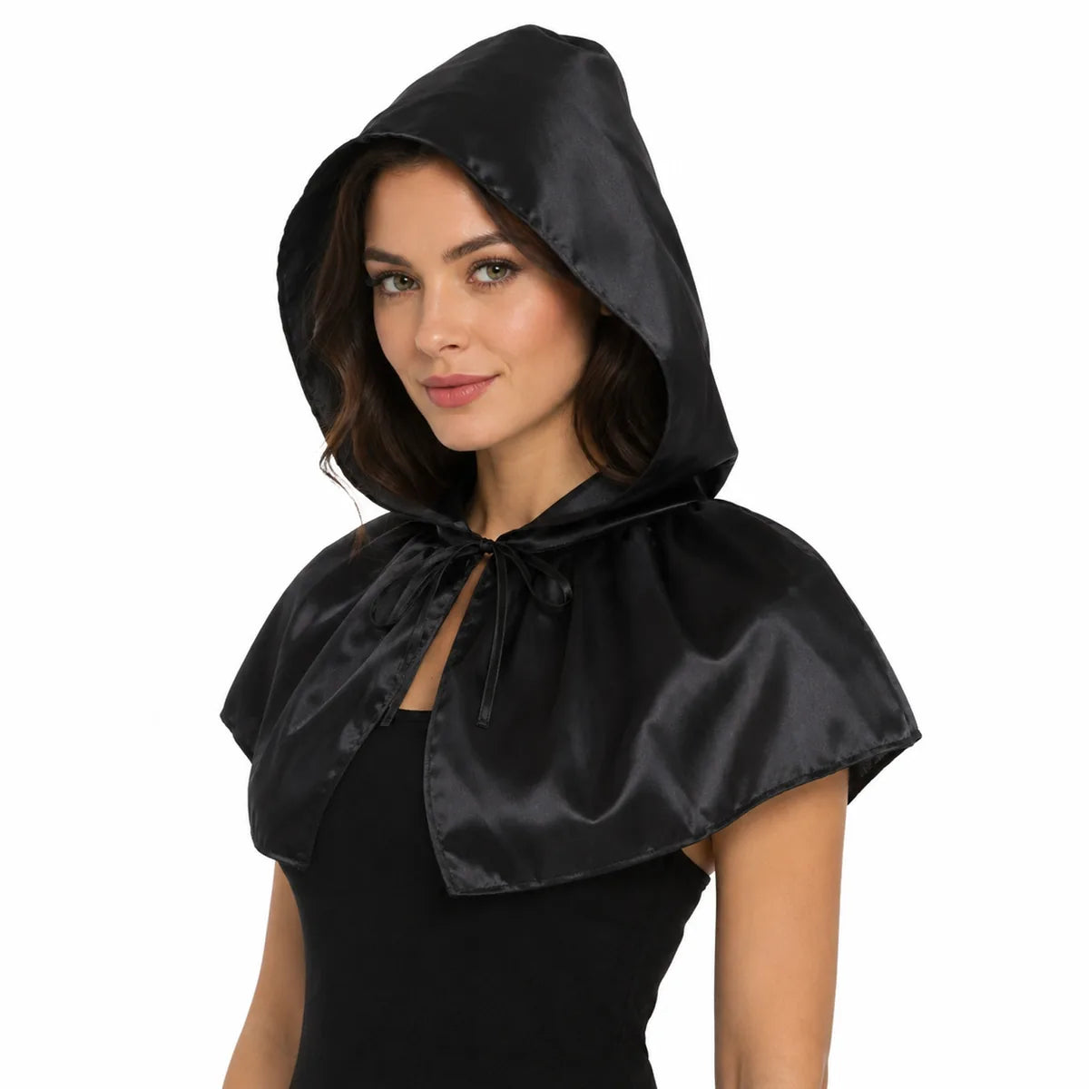 Woman wears the black hooded capelet tied at the neck.