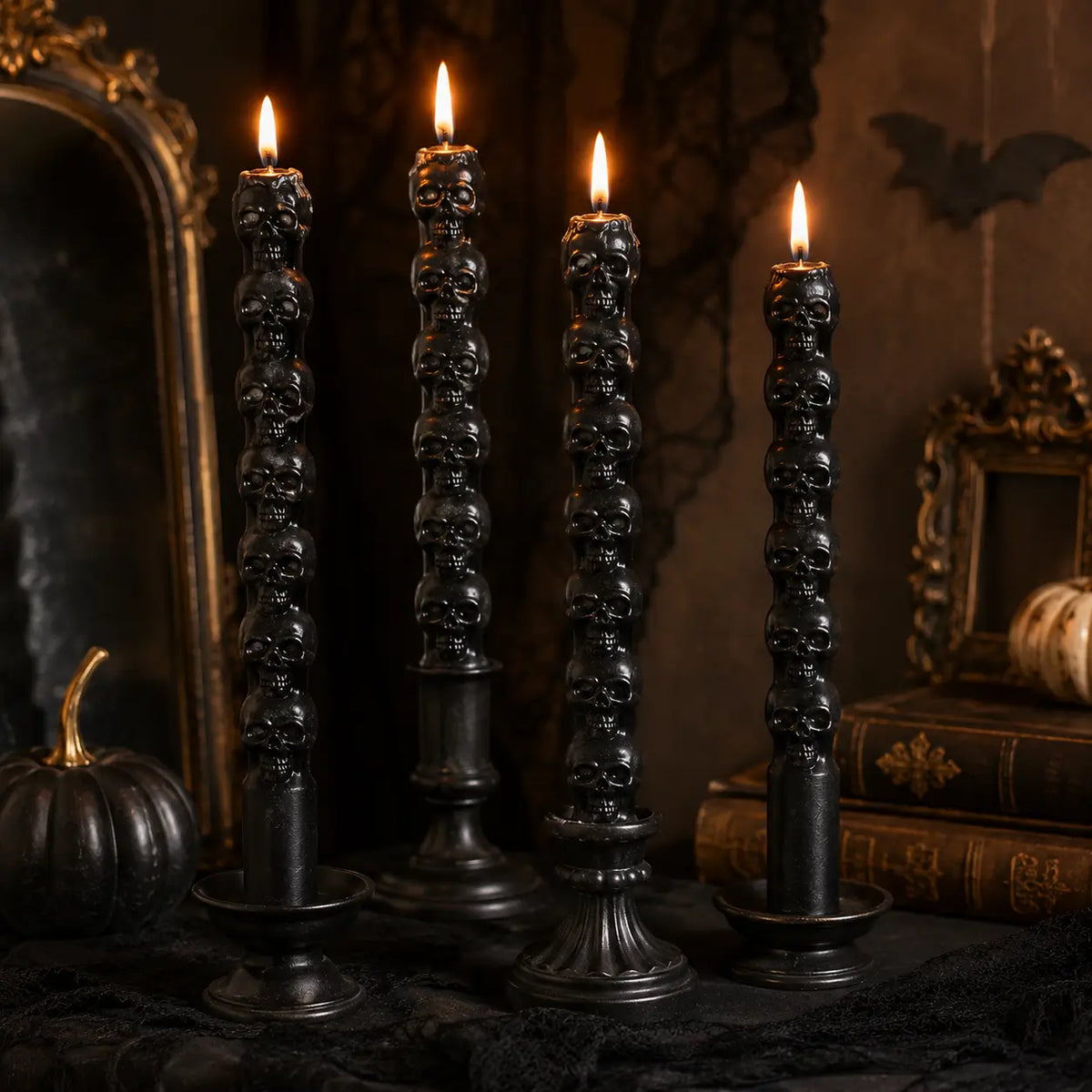 Skull-shaped candles, pumpkins and seasonal objects in a gothic display