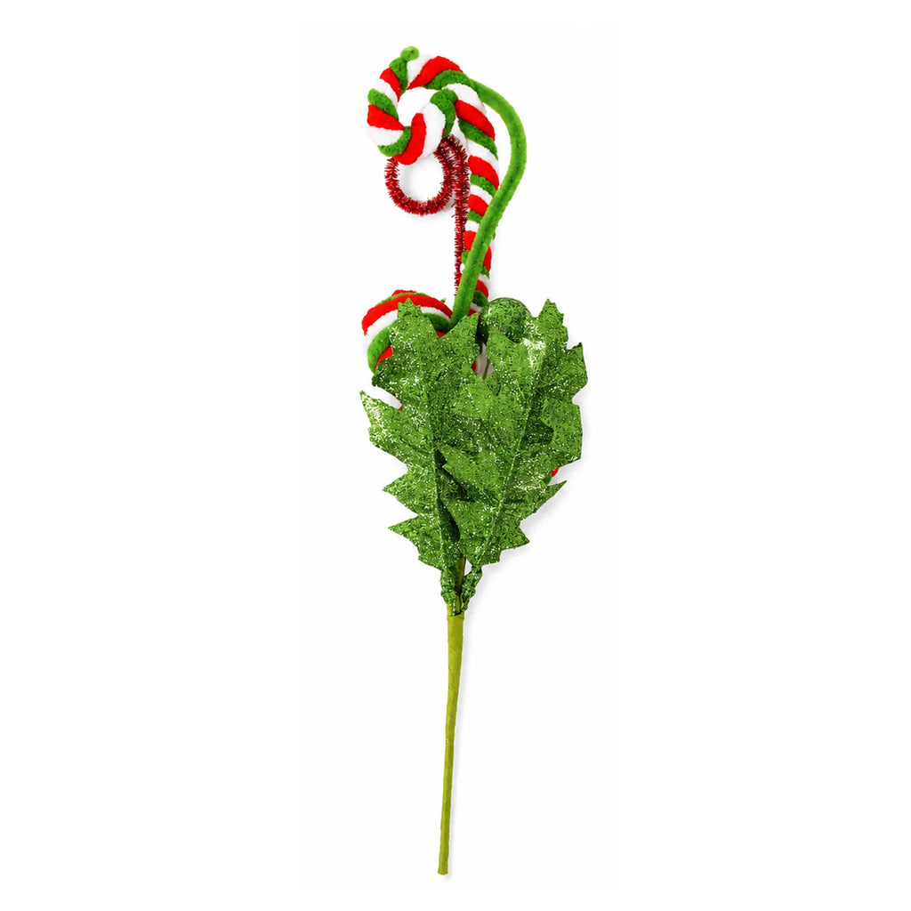 The back of a pick shows glitter-finished green faux holly leaves and the wrapped stem.