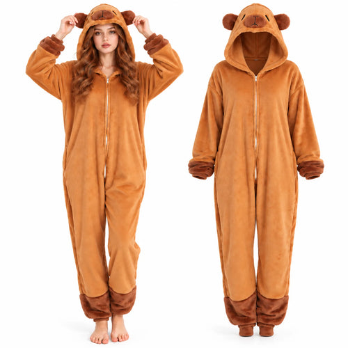 The brown capybara onesie shown worn by a model beside a flat lay of the garment, revealing the full front zipper and relaxed fit.