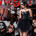 Women's gothic cat costume with layered tulle skirt at a pumpkin party