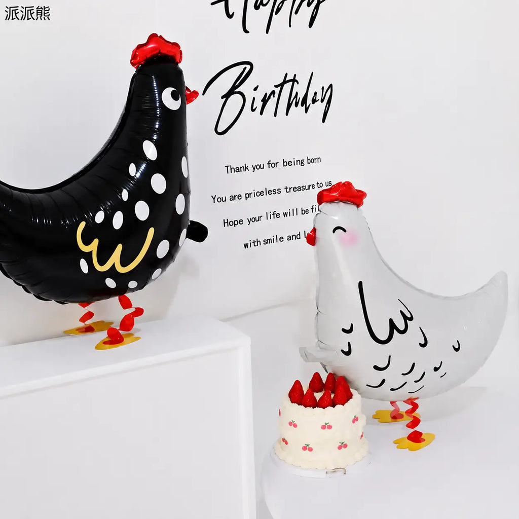 Black and white chicken foil balloons with birthday cake and Happy Birthday wall decoration