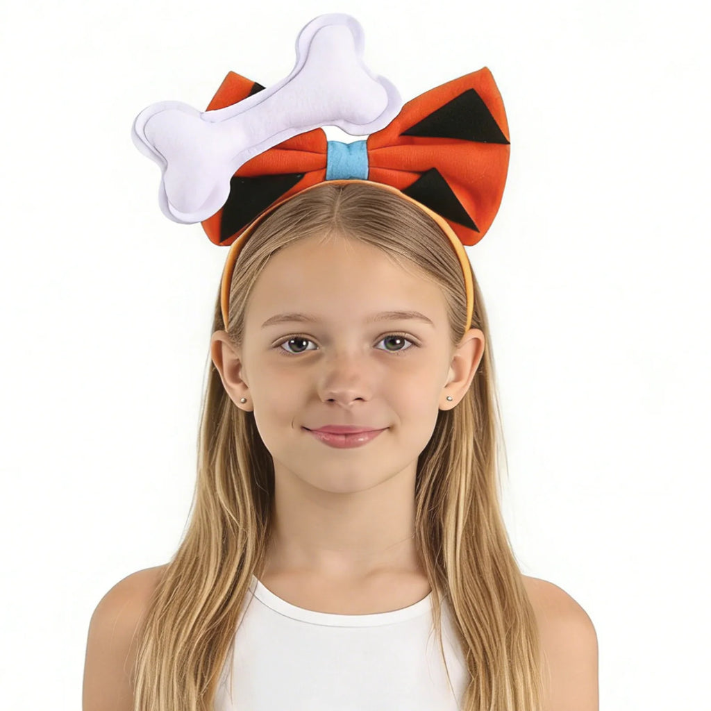 A child wears the orange cavegirl bone bow headband from the front, showing the white bone and black-spotted bow.