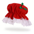 Red Christmas bonnet with white lace edging and holly berry decoration.