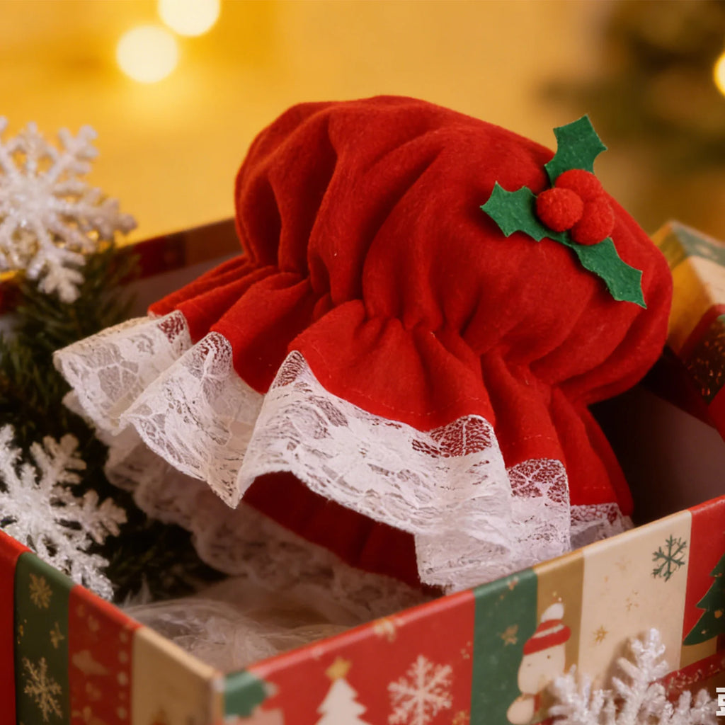 A close-up shows the red bonnet and white lace in a gift box.