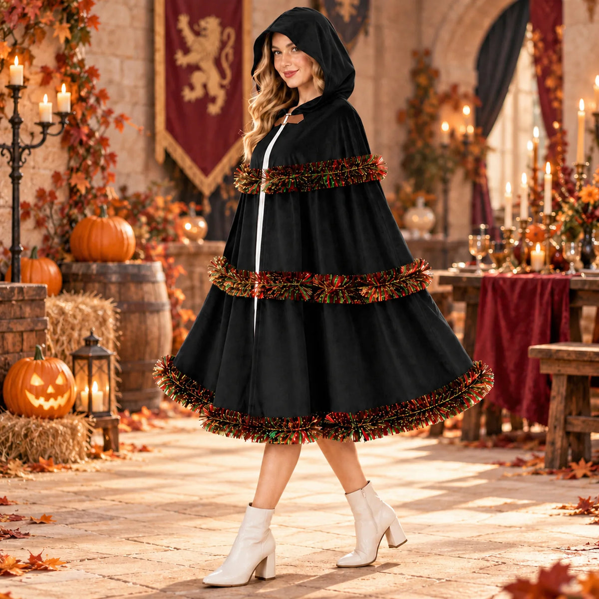 The black cloak appears on a model in a candlelit autumn setting.