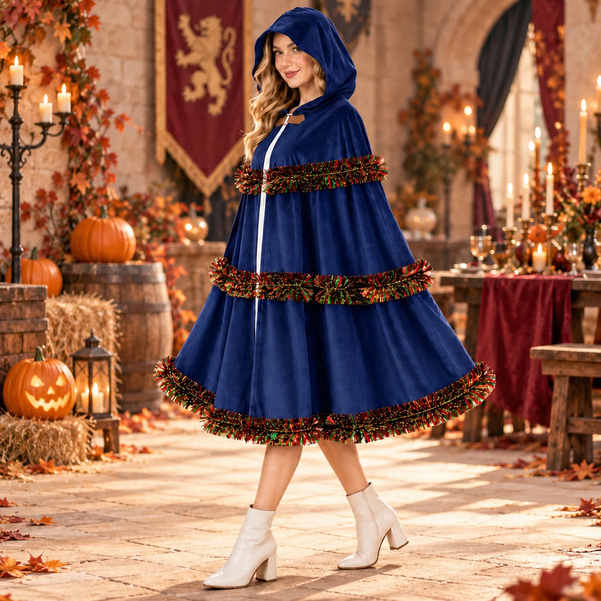 The blue cloak appears on a model in a candlelit autumn setting.