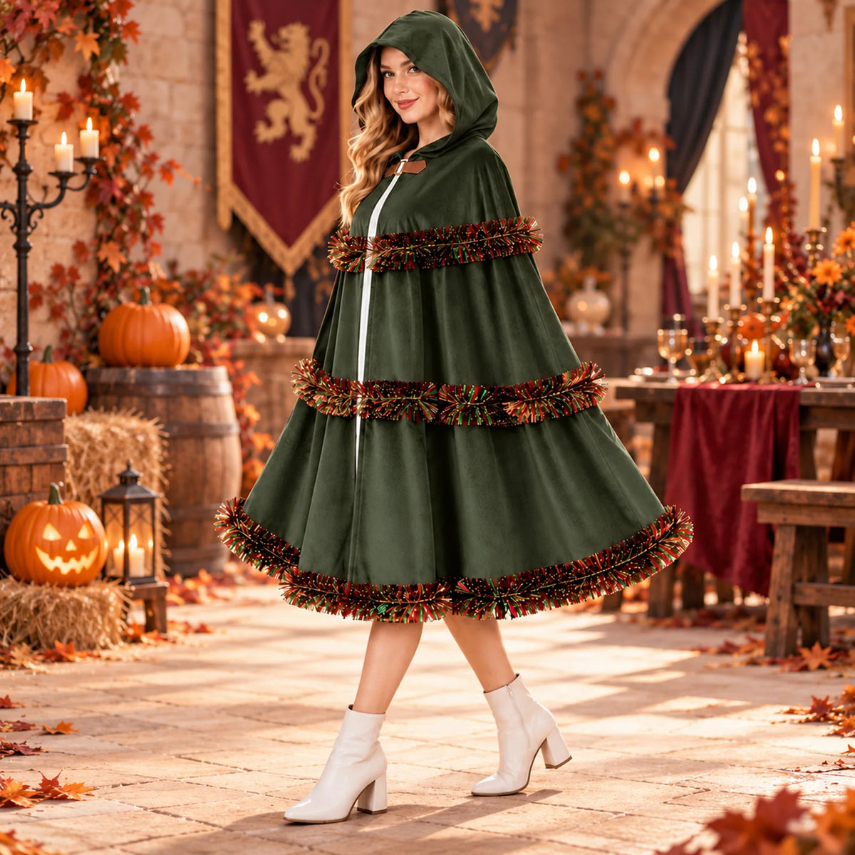 The green cloak appears on a model in a candlelit autumn setting.