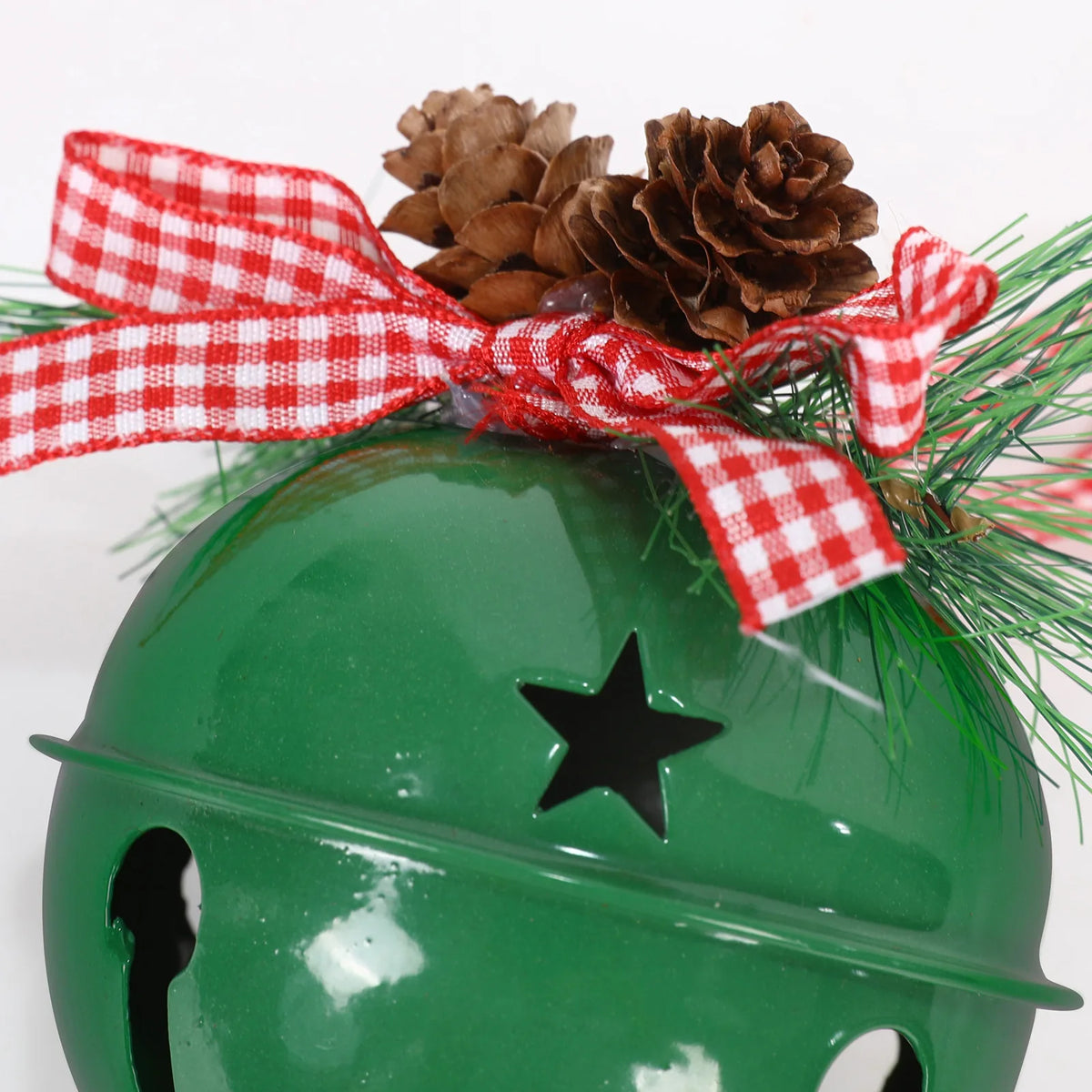 Close-up of the gingham ribbon bow and pine cones on the Green Christmas bell ornament
