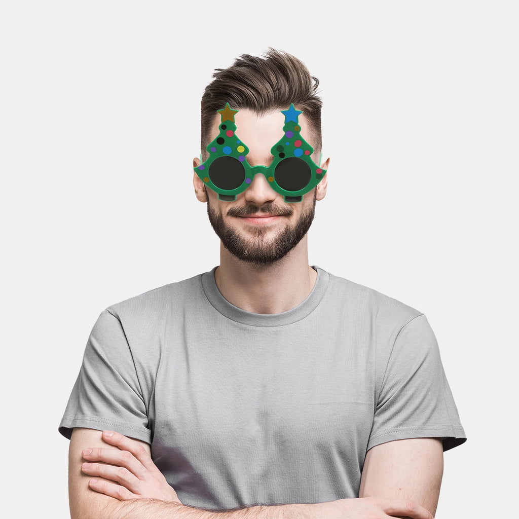 A model wears green Christmas tree novelty glasses with colored decorations.
