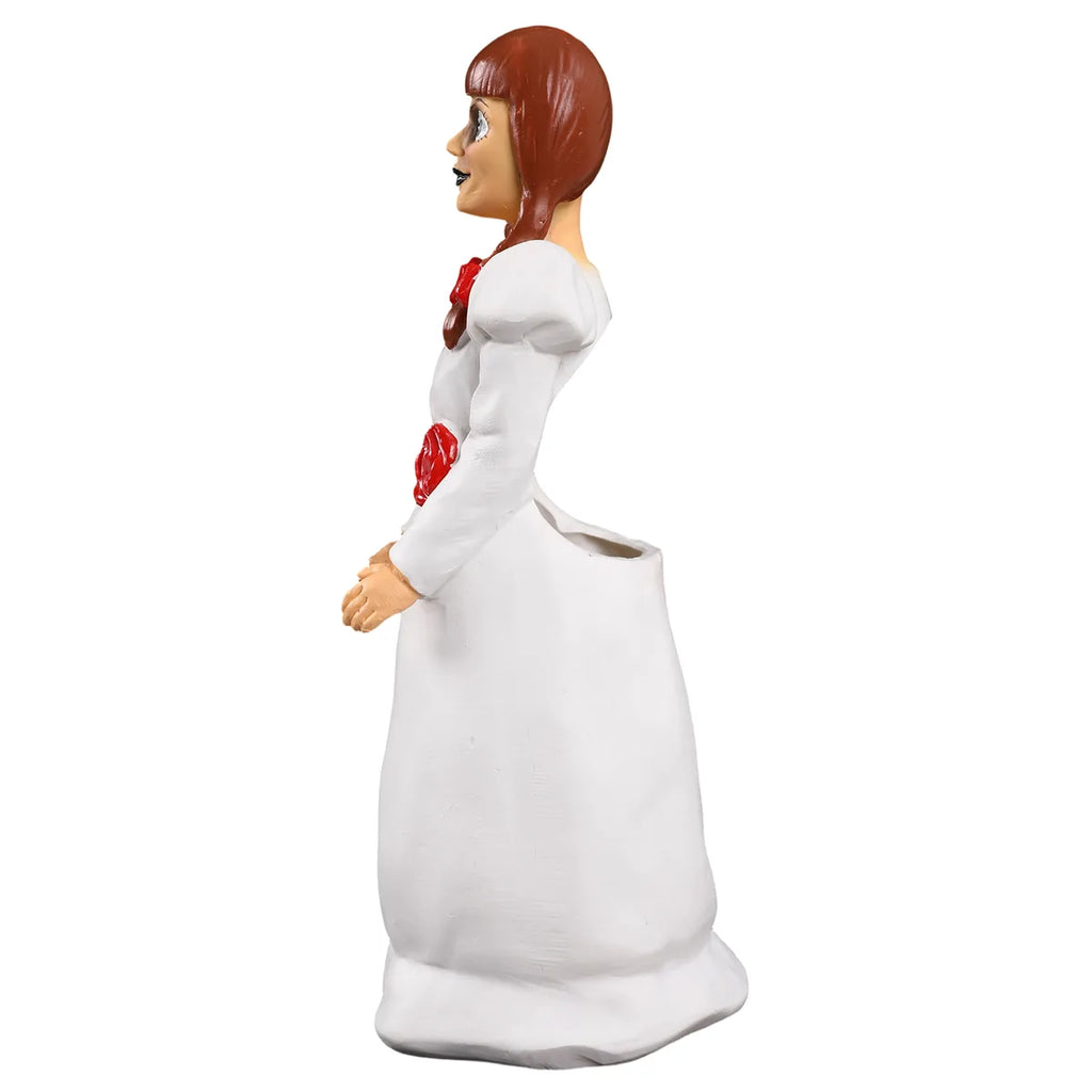 Side view shows the sculpted doll profile and container shape.