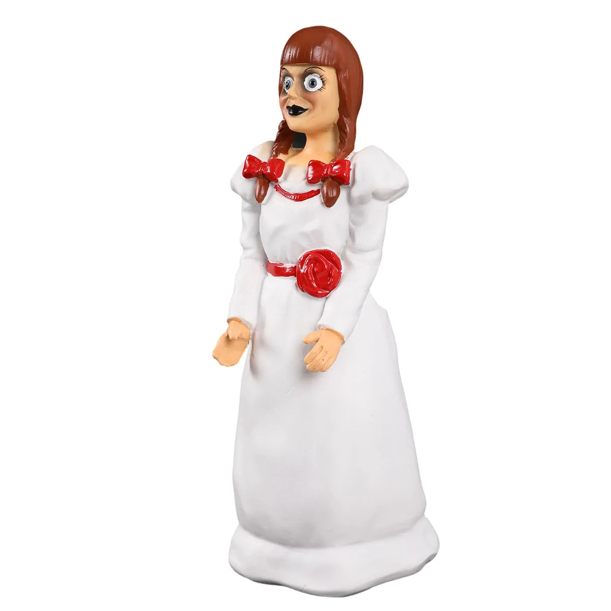 Three-quarter view shows the doll face, red bows, and white dress.