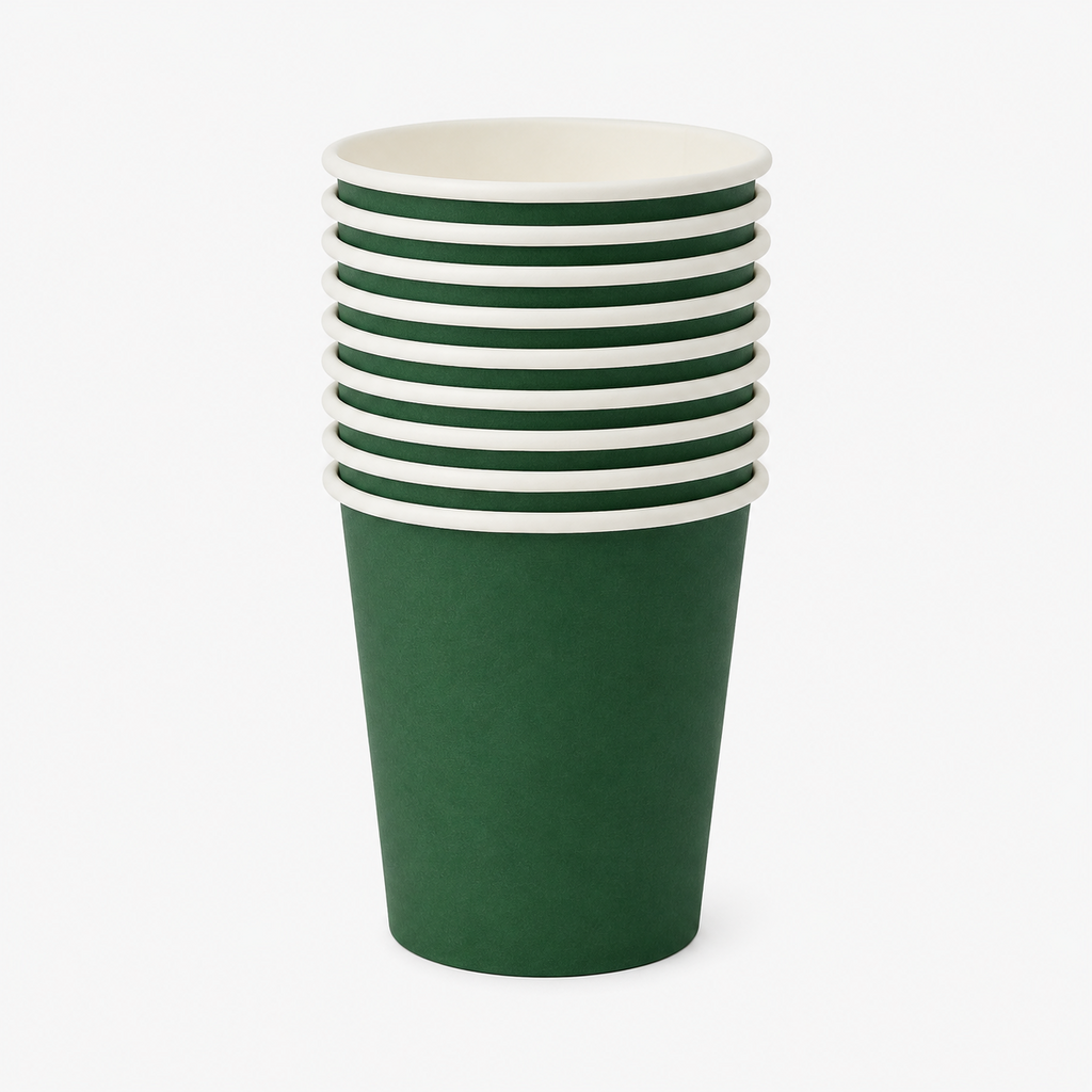 Stack of dark green disposable paper cups with white rims for Halloween, witch party, birthday, and themed party tableware.