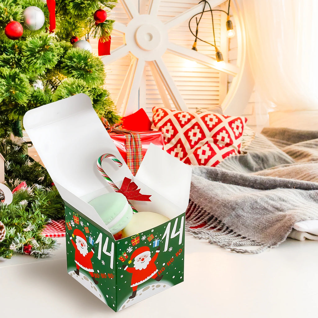 Open green Santa advent calendar box beside a Christmas tree, with decorative treats shown as props.