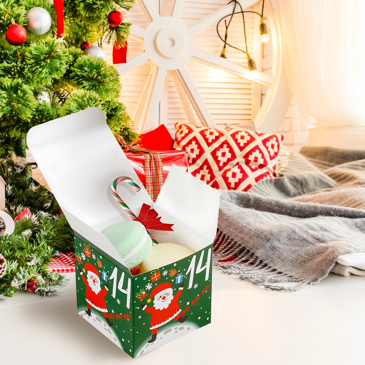 Open green Santa advent calendar box beside a Christmas tree, with decorative treats shown as props.