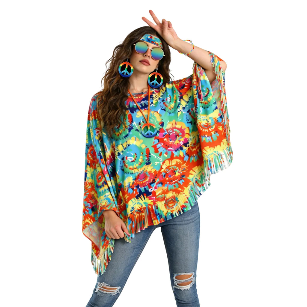 The model raises one arm to show the daisy bracelet, wide poncho sleeve, cut fringe and coordinating peace-sign accessories.