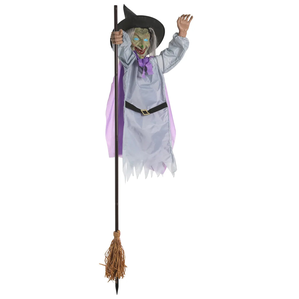 Three-quarter view of the flying witch on broom hanging decoration shows the layered costume and raised hand pose.