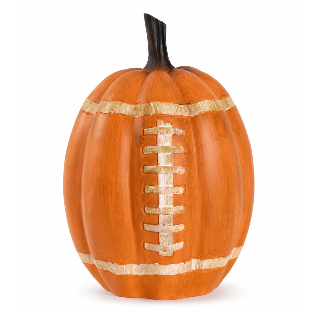 Orange pumpkin tabletop decor painted with football laces and stripes.