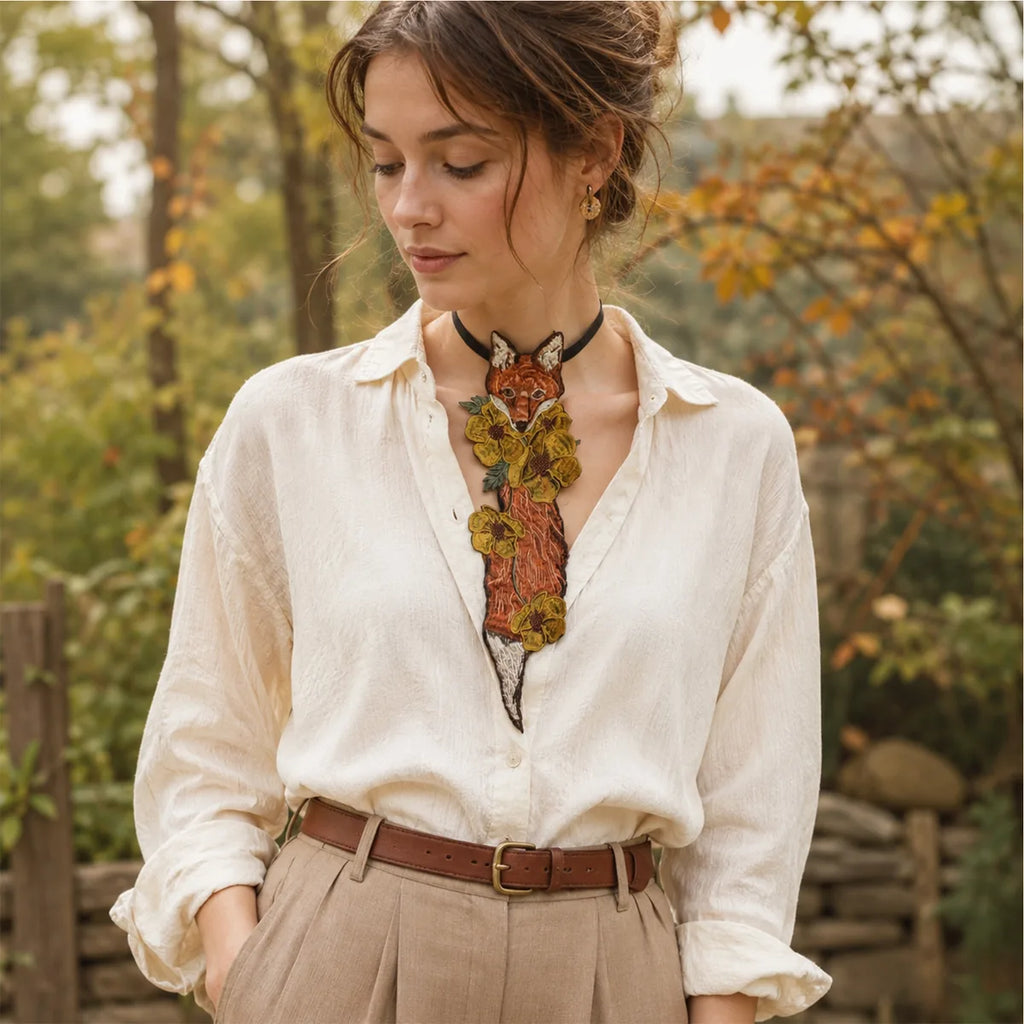 The fox floral embroidered necktie displayed in a styled Halloween scene for visual context.