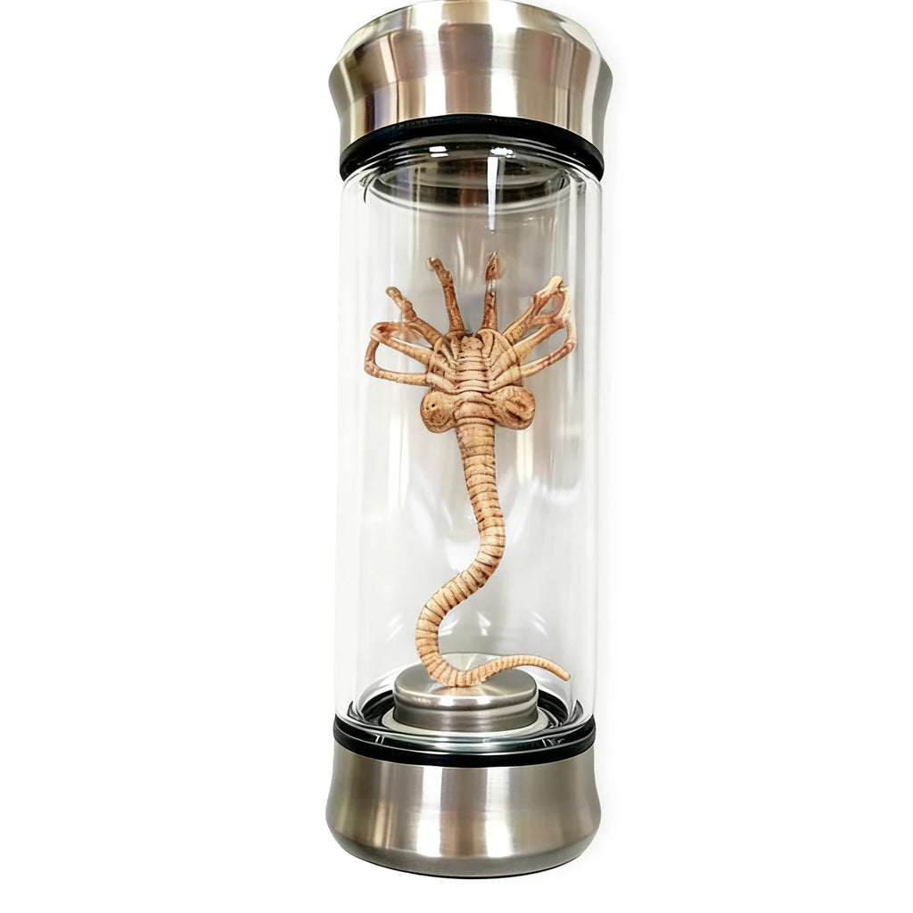 A front view shows the alien specimen jar light and detailed creature figure, with the clear specimen jar, sculpted alien creature and green illumination clearly visible.