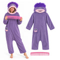 An adult models the purple open-face monster hooded onesie beside the garment and pink comb.