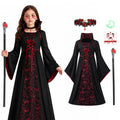 Girls vampire dress displayed with matching costume accessories arranged together for a complete Halloween outfit