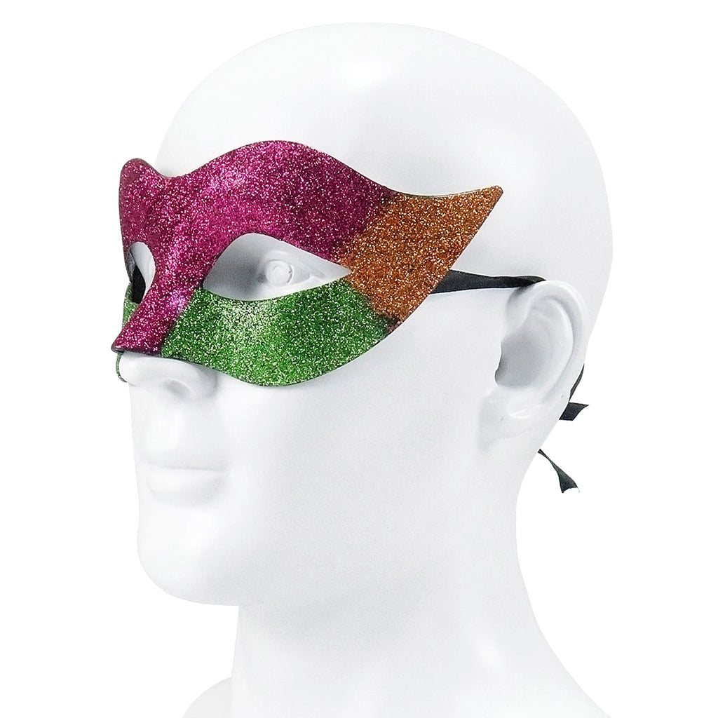 Glitter carnival eye mask shown from an is shown from a three-quarter angle, highlighting the purple, green and gold glitter panels with pointed side accents.