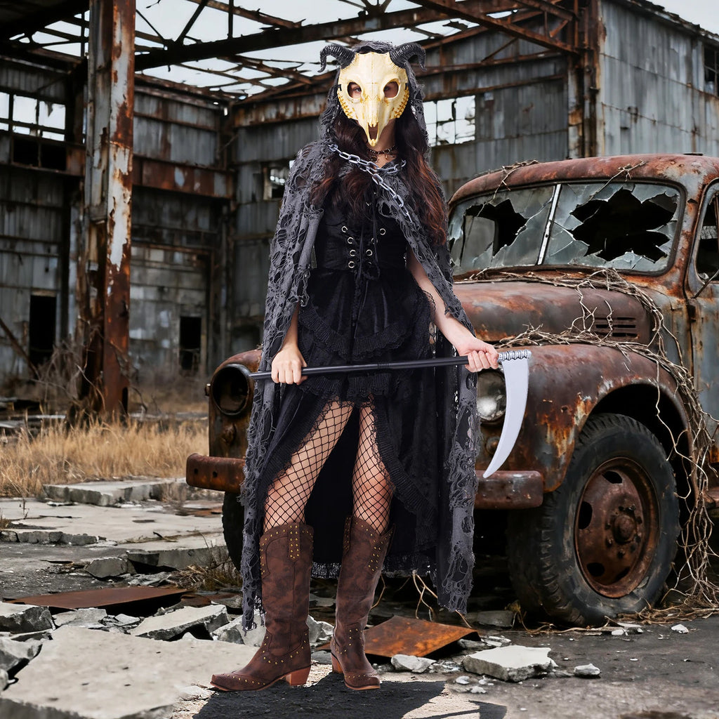 Goat mask costume for women styled with black dress and distressed cape at a Halloween event