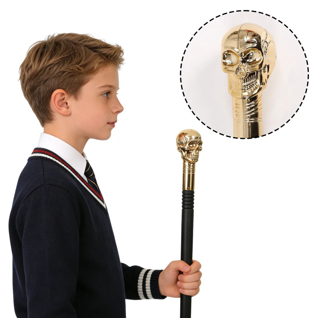 Back view of the gold skull costume scepter, showing the rear shape and visible construction.