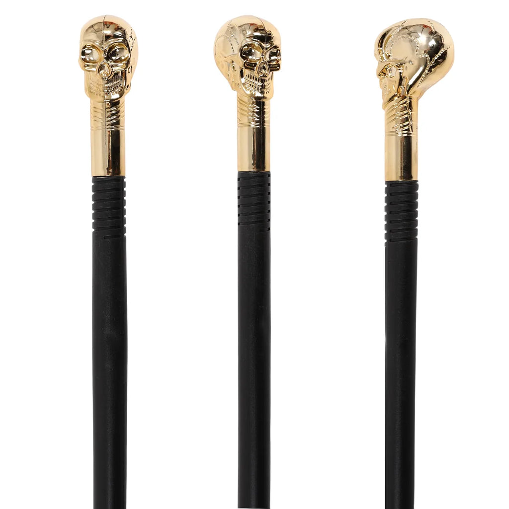 Side view of the gold skull costume scepter, showing its profile and visible construction details.