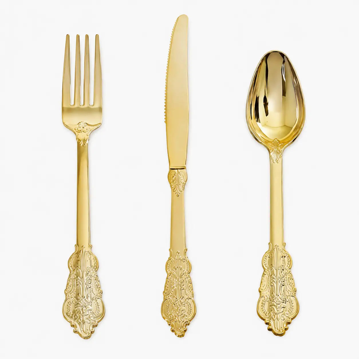 Gold vintage-style fork, knife, and spoon set with ornate handles on white background