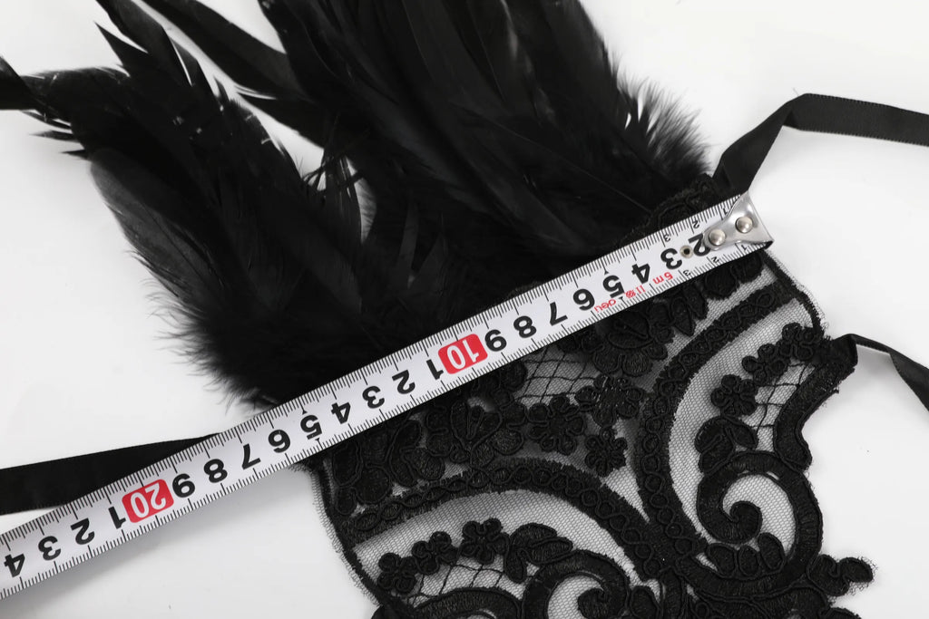 Tape measure shows the width of the gothic lace feather wrist cuffs.