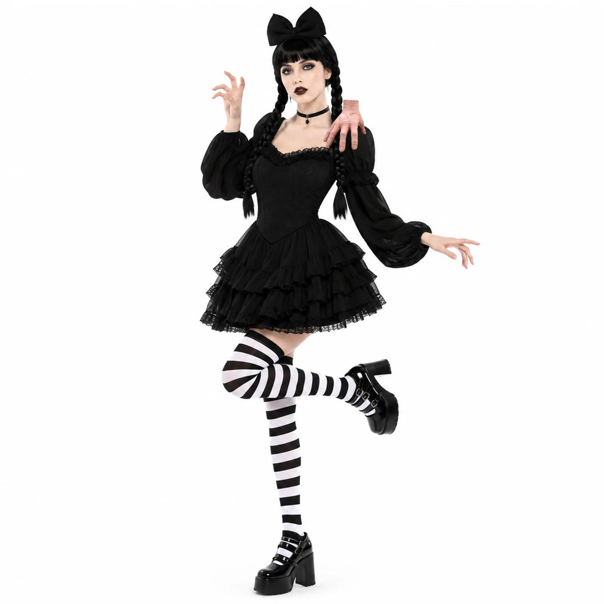 A costumed model poses in the four-piece gothic accessory look with the fake hand prop.