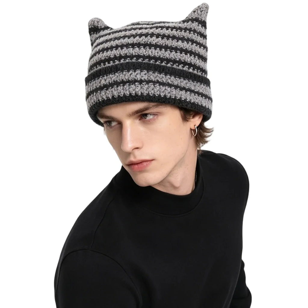 Adult model demonstrates the unisex fit of the striped knit hat.