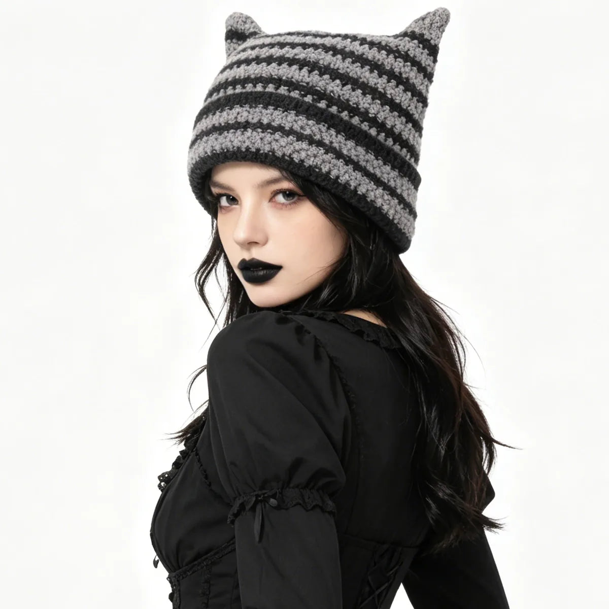 Side view shows the striped hat fitted over an adult's hair.