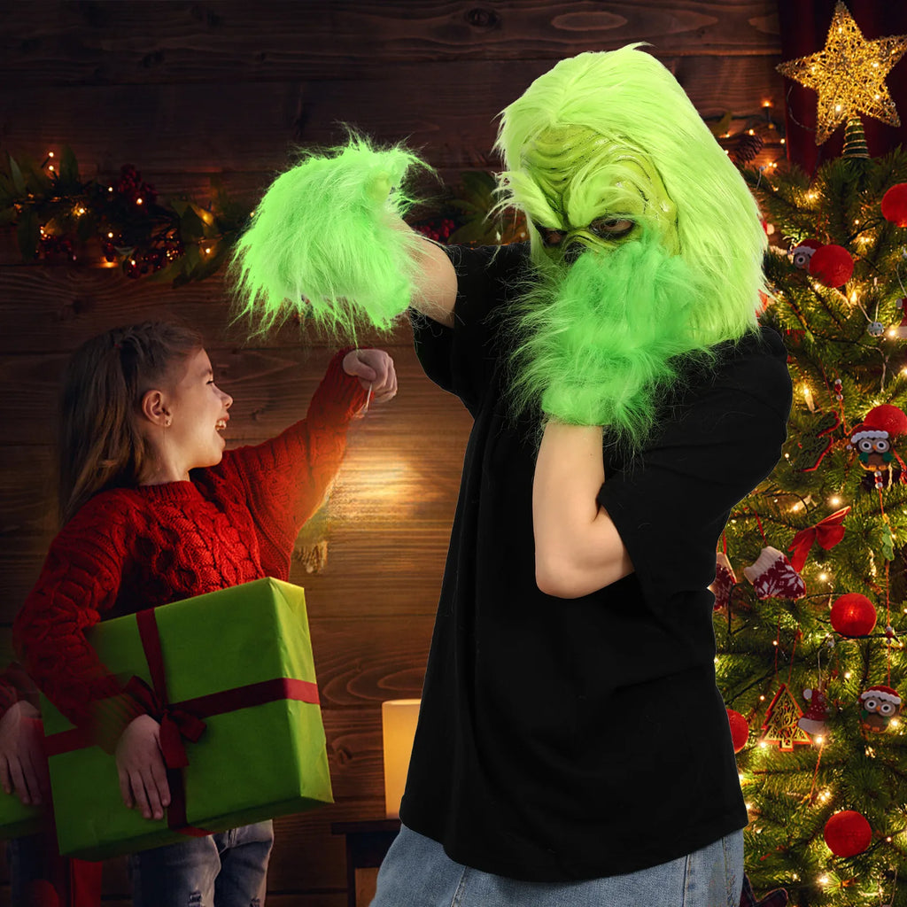 A model wears the green mask beside a Christmas tree and gift boxes.