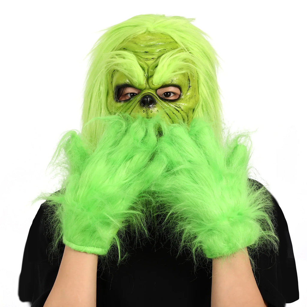 Two separate green gloves frame the face of the worn green character mask.