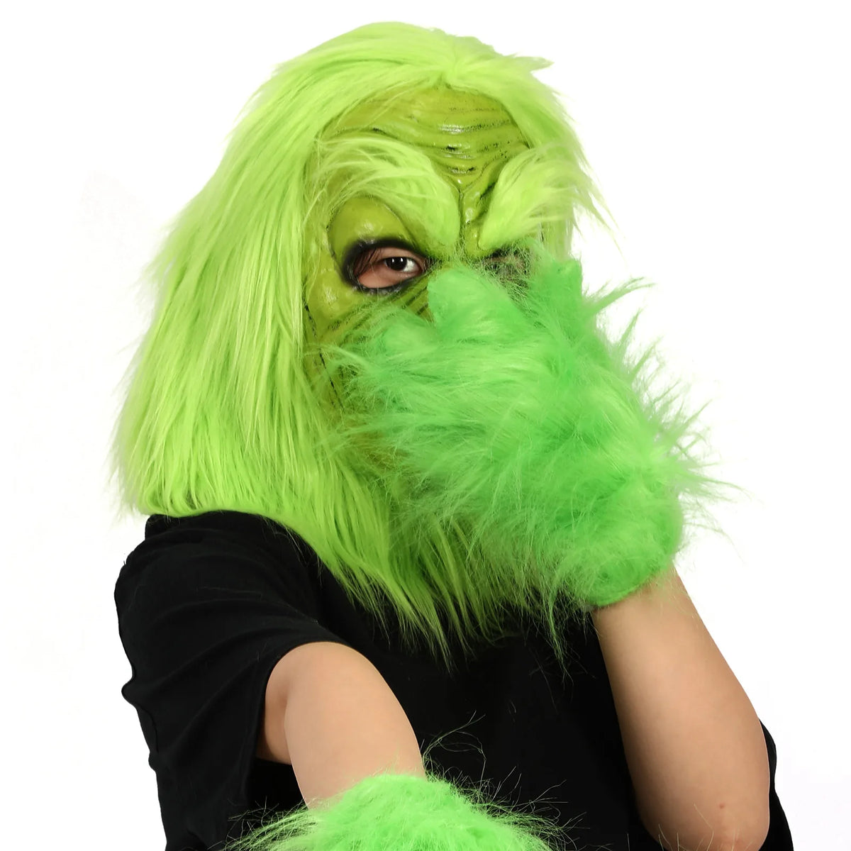 A quarter-profile worn view shows the green mask nose and long hair.