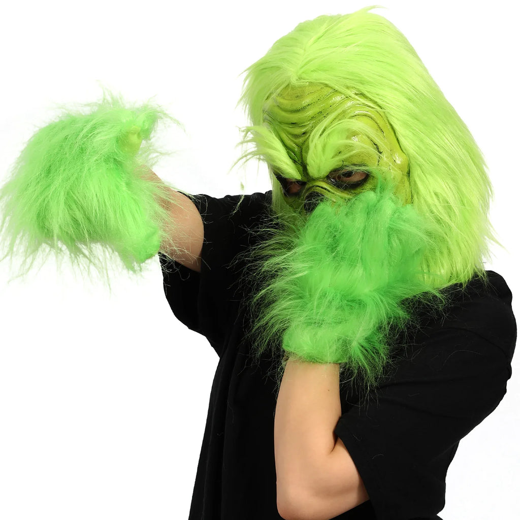 A model raises one arm while wearing the green mask and separate gloves.
