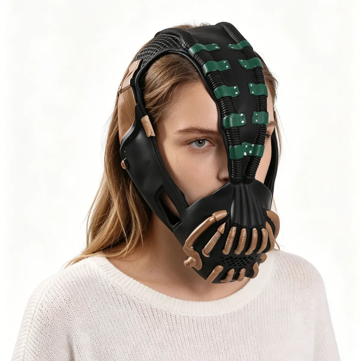 Side view shows the green and gold mask fitted around an adult's face.
